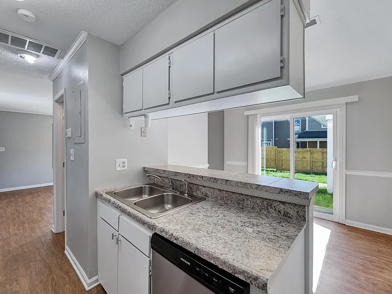You have a bar for an eat in kitchen as well as a dining room that can fit about a 6 person table
