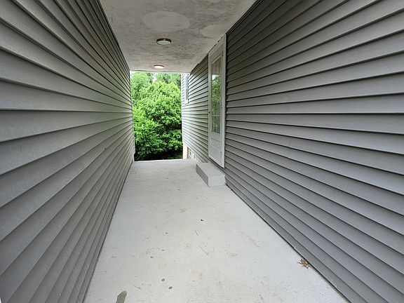 Covered side door entry for 2nd floor unit