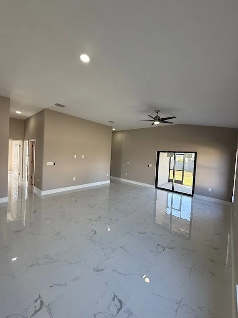 Brand-New Luxury Home with 3-Car Garage & Lawn Care Included | Modern Living in Cape Coral! — Photo 3
