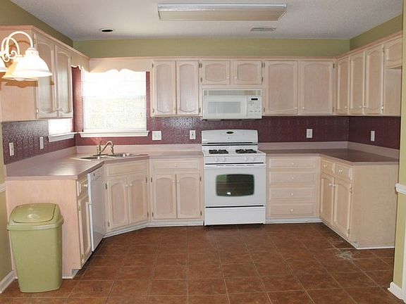Kitchen
						:
						Kitchen has light oak cabinets, gas stove, disposer, pretty new Bosch dishwasher