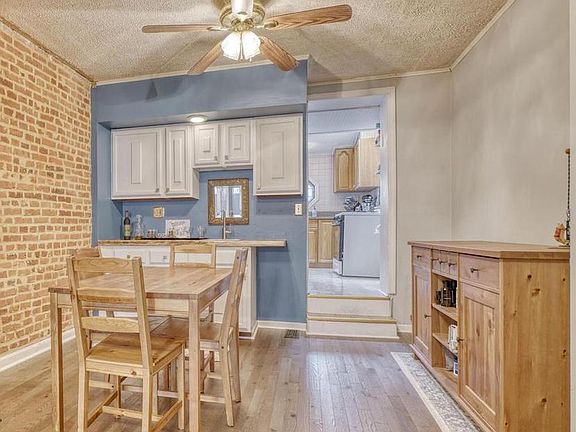 Dining area comes with a small hutch and mini wet bar perfect for entertaining or after works drinks.