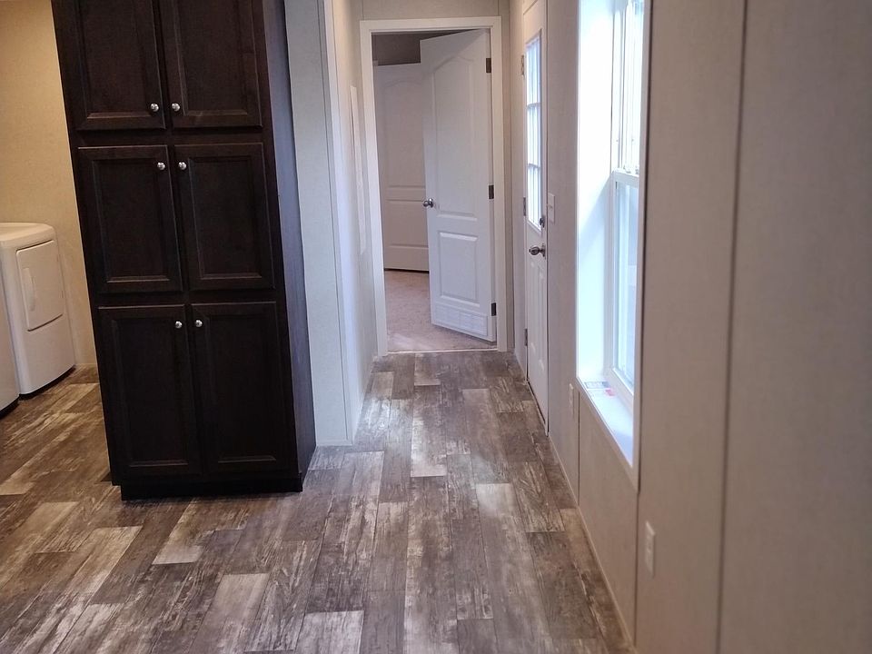 Kitchen , looking down hallway to one
of 3 bedrooms.