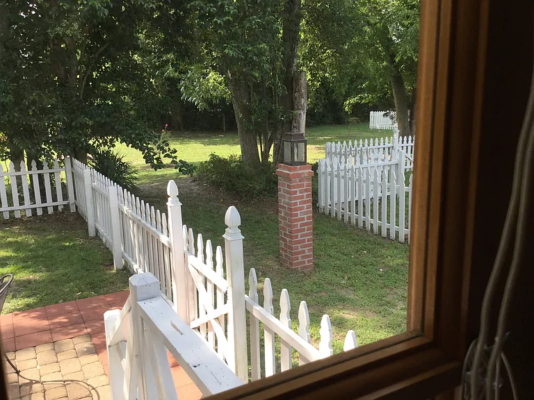 A rare combination of privacy, green space, and walkable Historic District living.