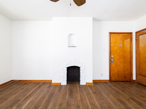 Decorative fireplace area in living room (fireplace is non-functional)