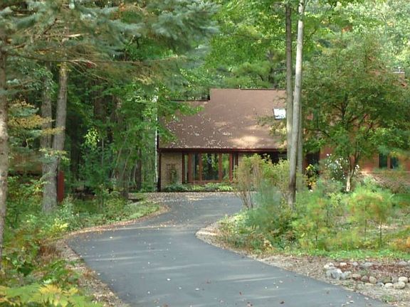Beautiful tree lined drive from street to house.  All the trees provide natural air-conditioning.(the house does have central air conditioning too!)