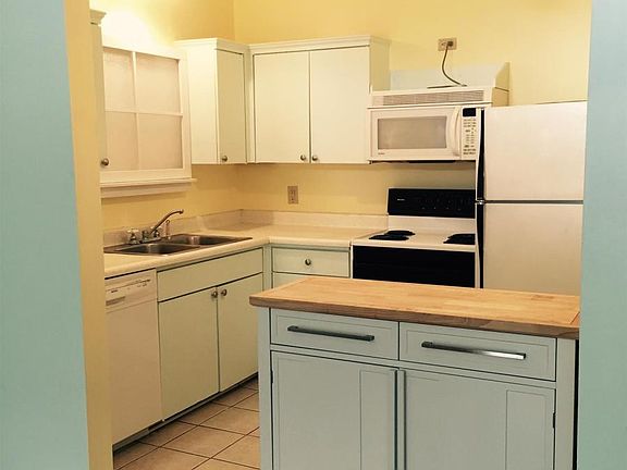 The kitchen has a homey vintage feel, and opens up to the li