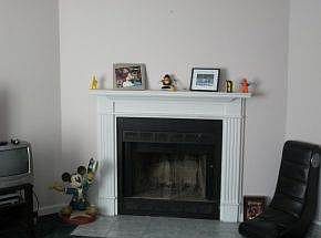 Living room w/ wood fireplace