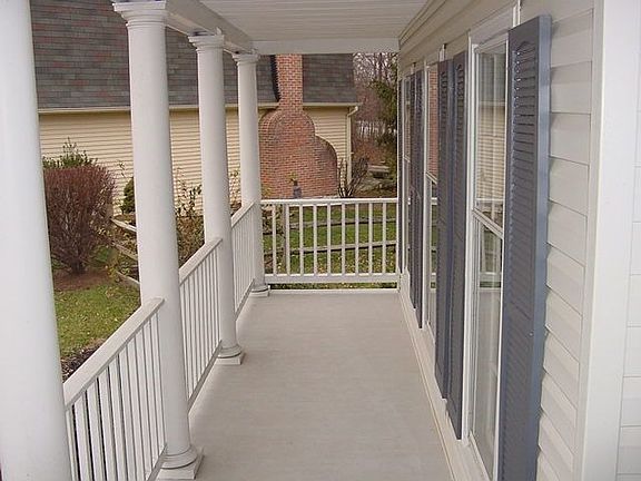 Covered Porch; Fenced yard on 0.26 ac