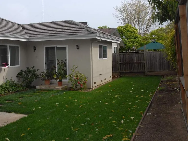 Backyard- Seamless indoor-outdoor flow with direct sliding-door access from both the Dining & Family Room and Primary Suite.
