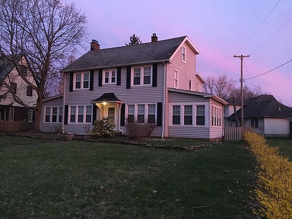 Left wing it the office. Right wing is the sunroom. Living room is to the left of the front door and dining room to the right. Kitchen is behind the dining room. Center window over the front door is the main bathroom on the 2nd floor. Master bedroom is to