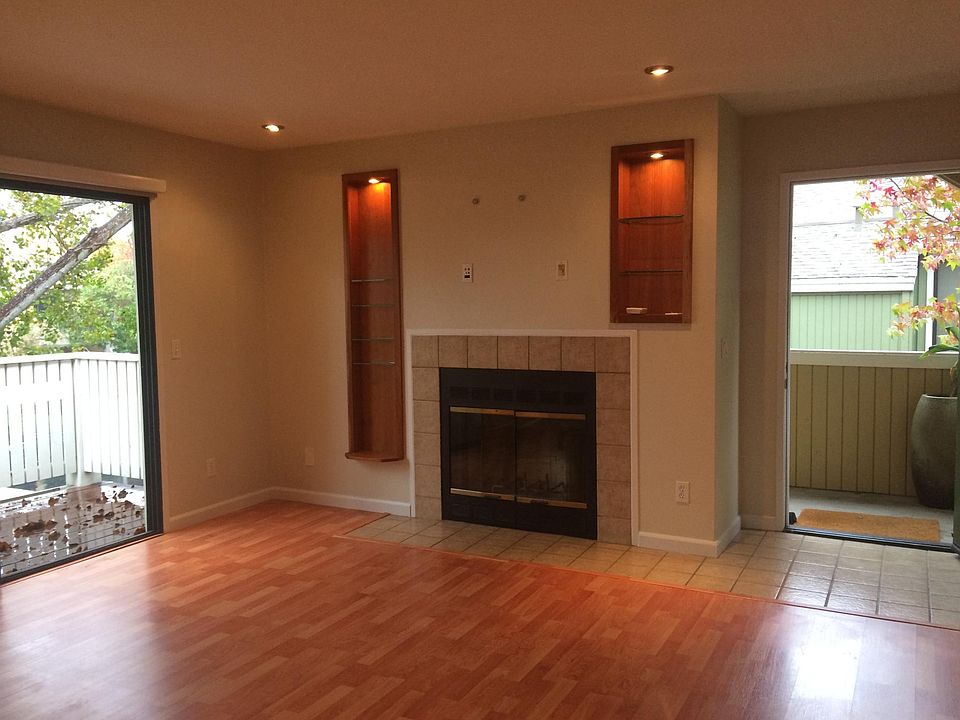 wood floor, balcony, fire place and wall hook ups