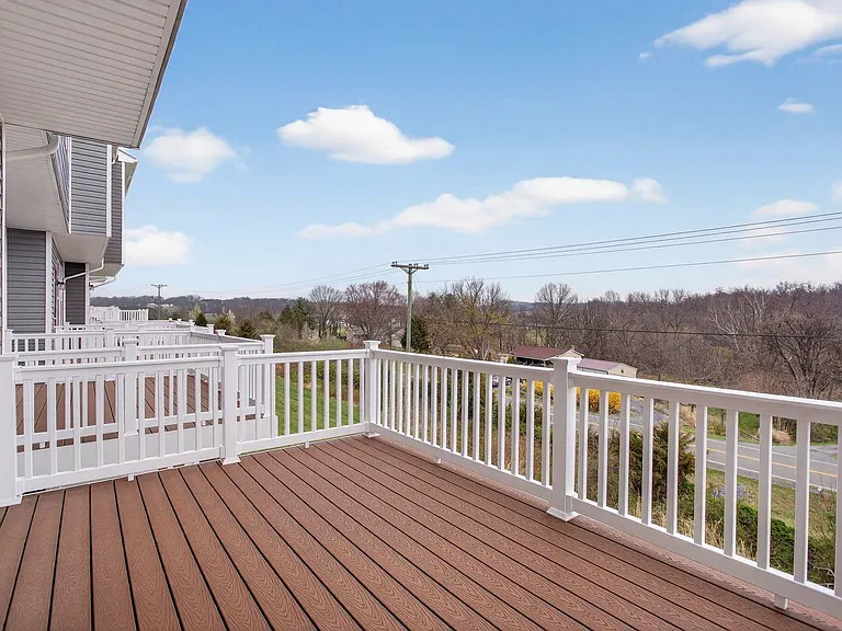 Elevated back deck off the dinig area; Trex material