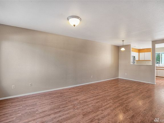 Laminate hard surface thru all of downstairs- open & bright