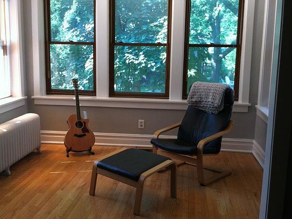Den/ office. Original wood floor, 7 windows.