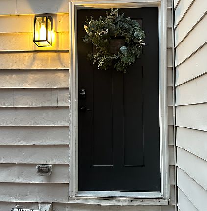 Entry to apartment on side of house