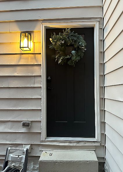 Entry to apartment on side of house