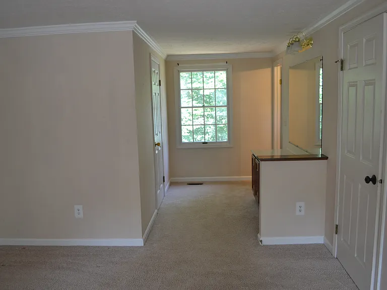 Primary bedroom toward bathroom and walk in closet
