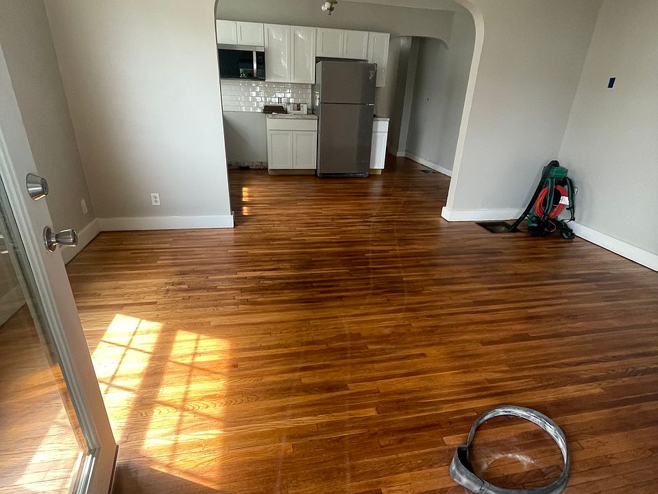 Living Room / Kitchen area while hardwood floors were being refinished