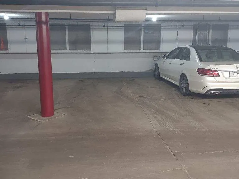 Designated parking spot with storage above