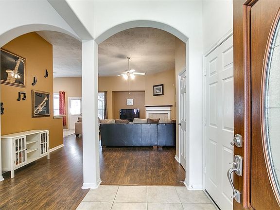 Inviting entry with arched columns.