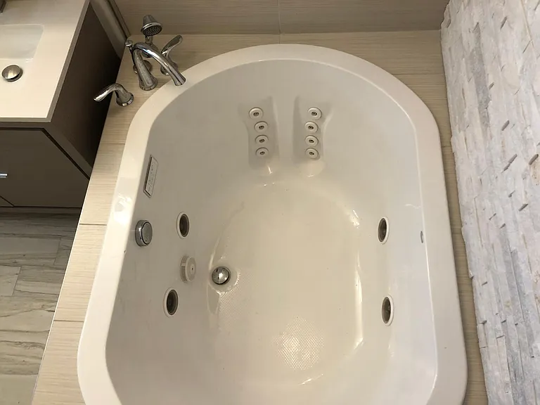 Jacuzzi tub with jets, inline heater and mood lighting.