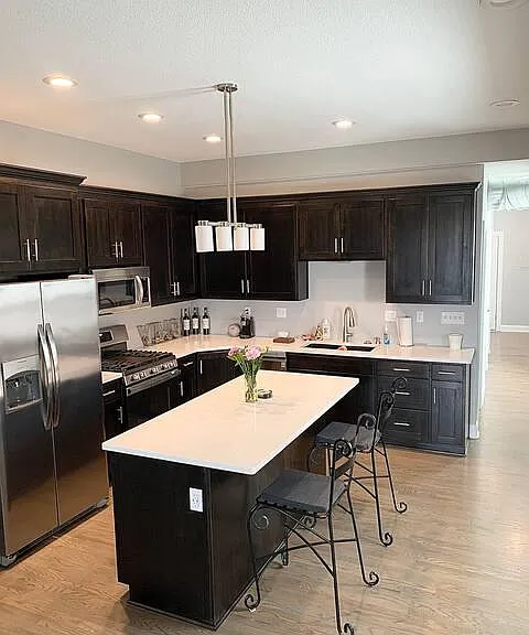 Island is very large to accomodate entertaining friends while cooking. It also features large work from home space with USB outlets.