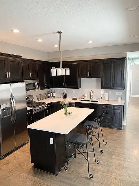 Island is very large to accomodate entertaining friends while cooking. It also features large work from home space with USB outlets. - 535 Troost Ave #A