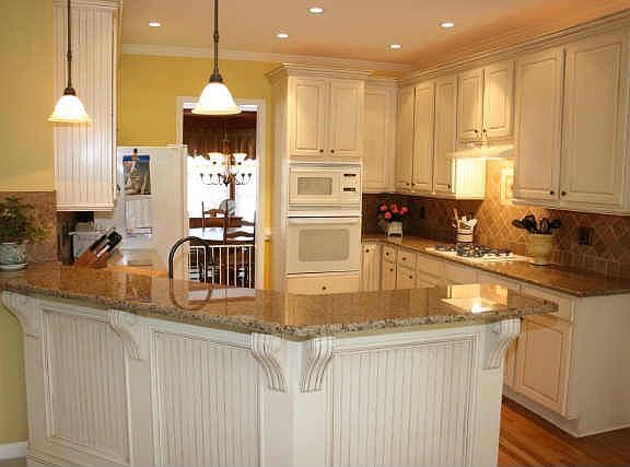 Granite kitchen with tumbled marble backsplash