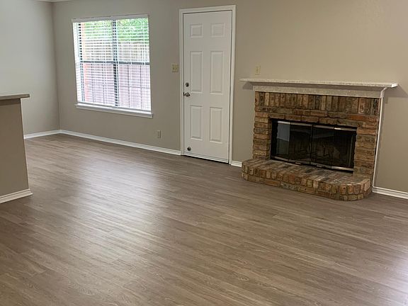 Living Room w/ Wood burning Fireplace