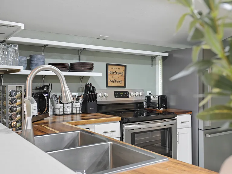 Fully stocked kitchen with drip coffee maker, blender, pots, pans, seasonings, etc. All your kitchen needs are here.