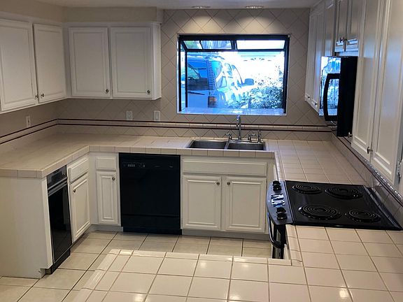 Newly painted cabinets in kitchen and all bathrooms.