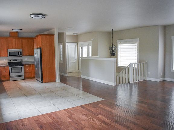 Main living space looking toward front entrance and hallway to Master Bedroom