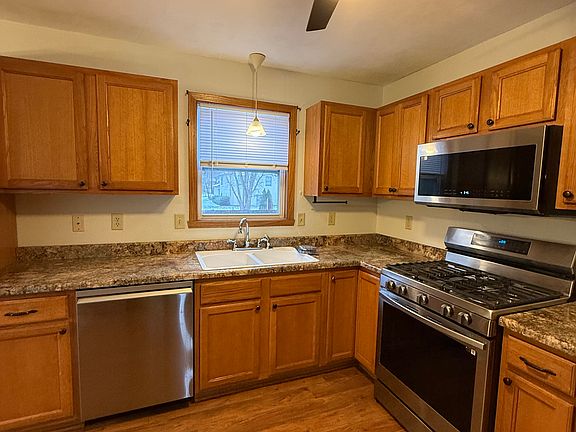 Kitchen with appliances and fan
