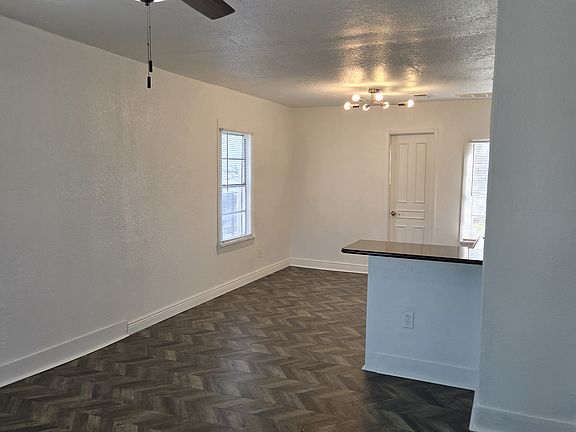 View of LR and eat in Kitchen area with bar