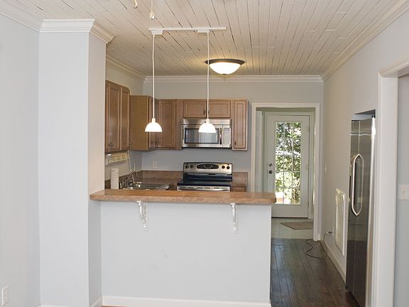 From entrance looking toward breakfast bar and kitchen