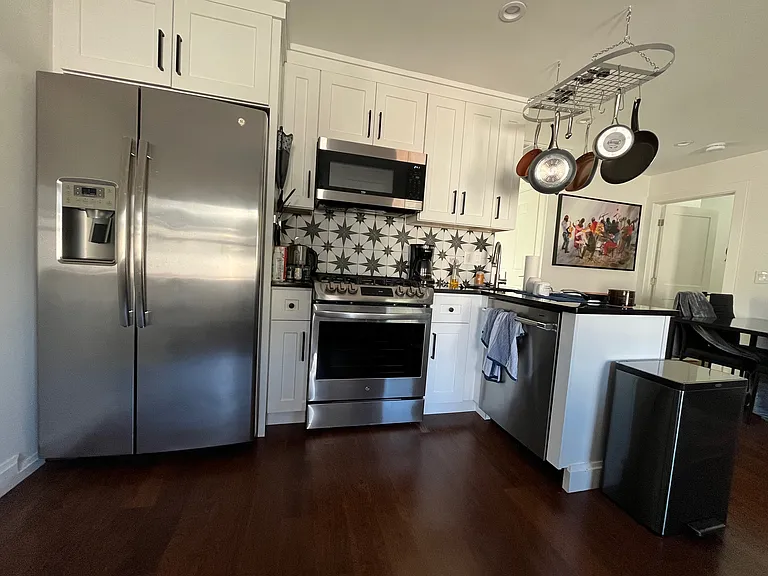 Look at the right side of this picture and you'll see there's room for a dining table and chairs next to the door to the staircase that leads to the master suite. This is an alternative location for the dining area showed in the floor plans.