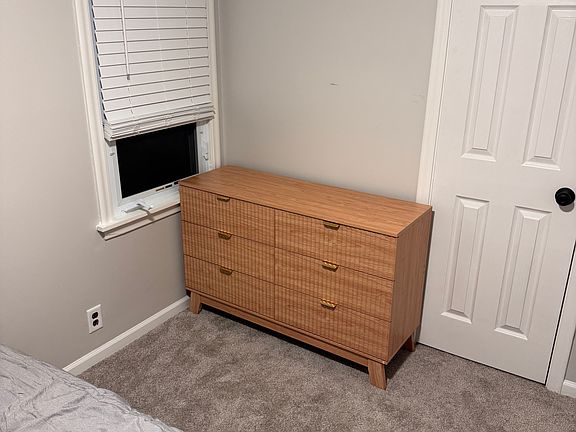 Cabinet can certainly be moved for improved accessibility to window