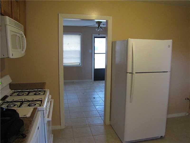 Kitchen looking into living room