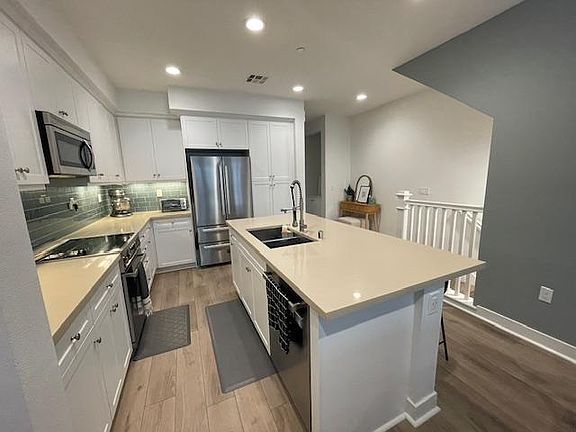 Quartz counter tops, large island prep with room to sit four.