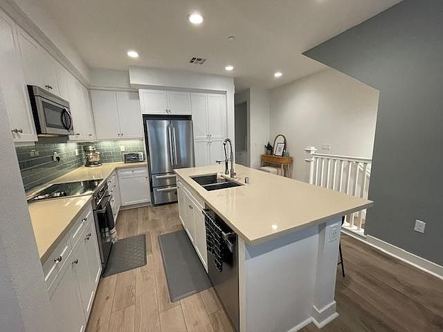 Quartz counter tops, large island prep with room to sit four.