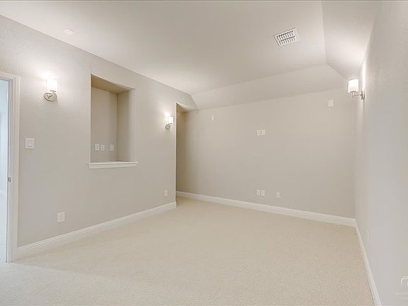 Media room in the Merlot home plan by Trophy Signature Homes - REPRESENTATIVE PHOTO
