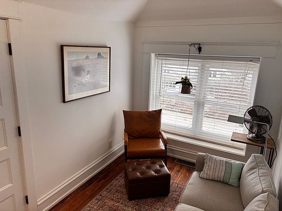 The sitting area is charming and cozy.