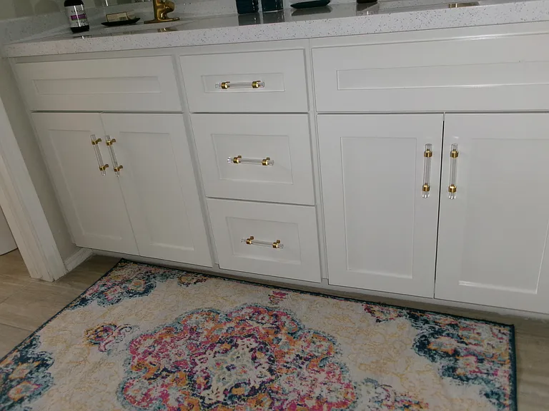 Gold hardware, gold faucets, new mirrors.