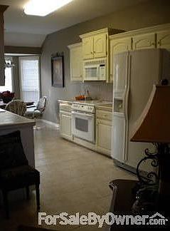 Kitchen
						:
						Tile countertops and flooring. Spacious kitchen with eat-in kitchen.
