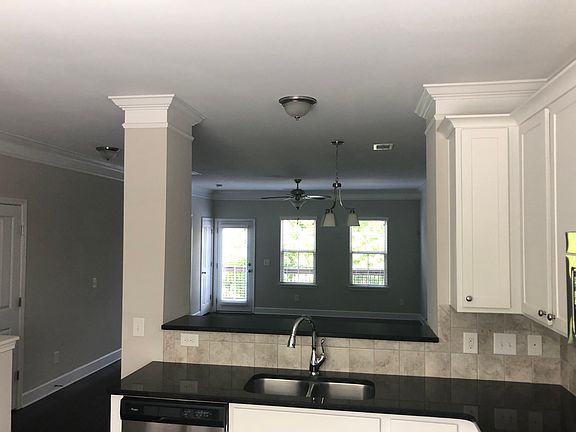 Powder room door on left.