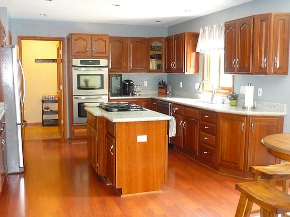 Cherry cabinetry + granite.