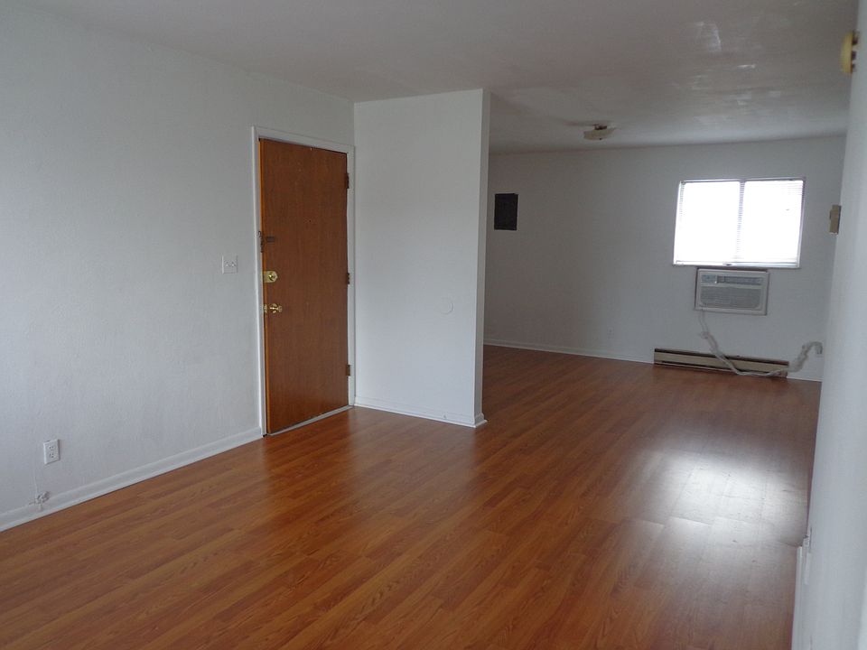 living area/ and bedding area, separated by a half wall