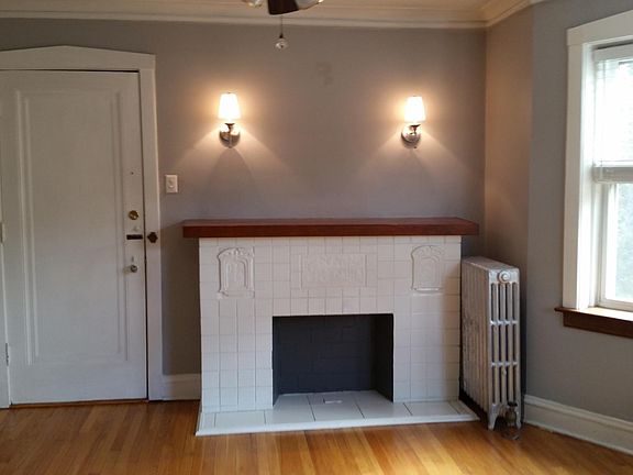 Sunny living room with decorative fireplace