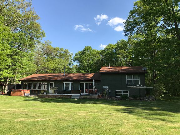 Back of home with deck 