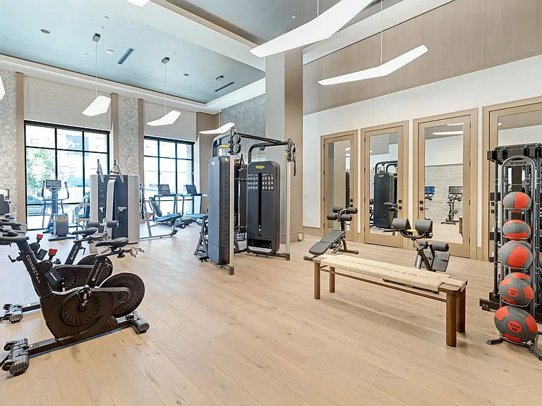 24-hour Technogym Fitness Center with Echelon Spin Bikes & Reflect Mirror, TRX and Rower